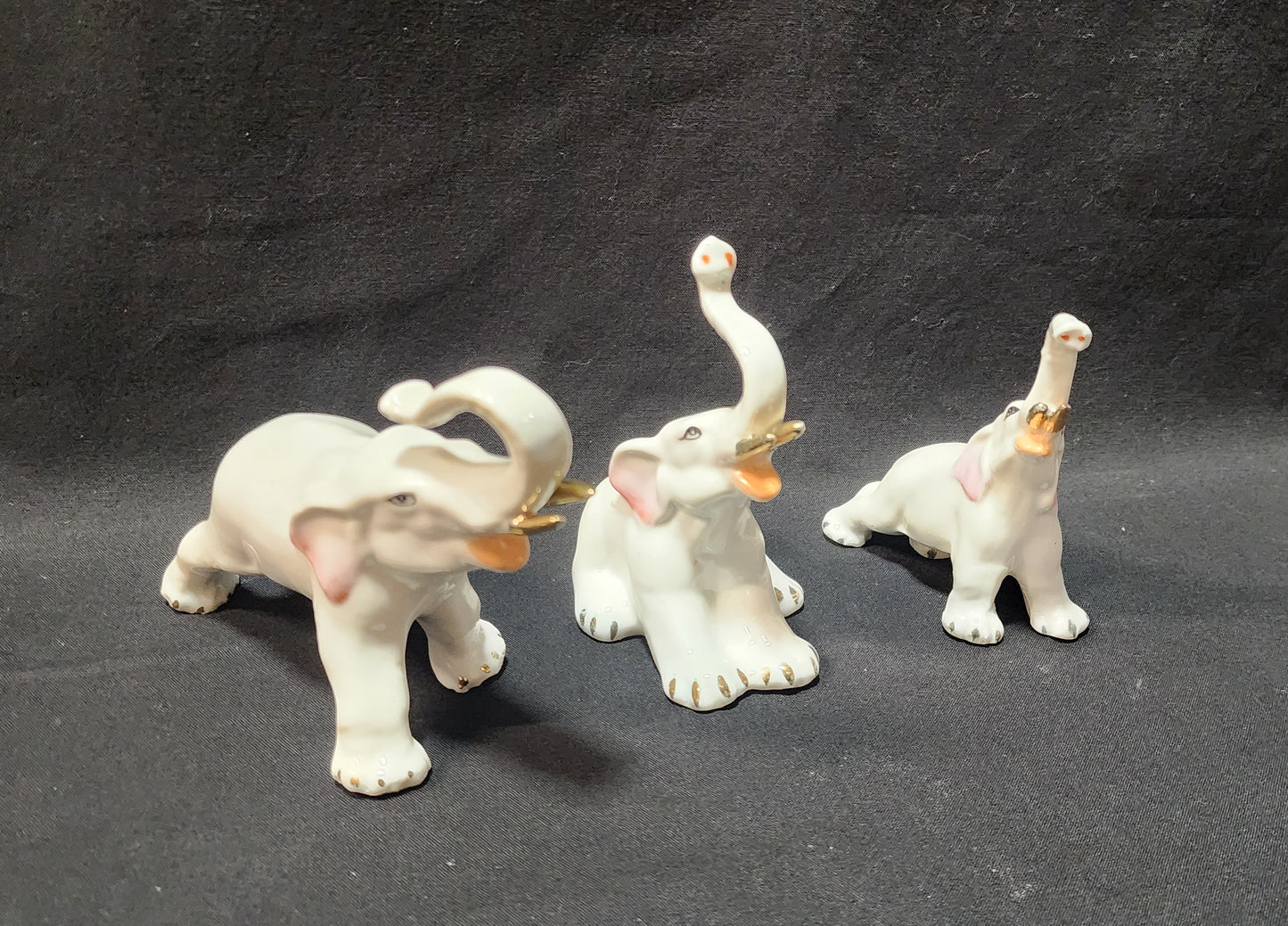 3 White Elephants With Trunks Up and Gold Trimmed