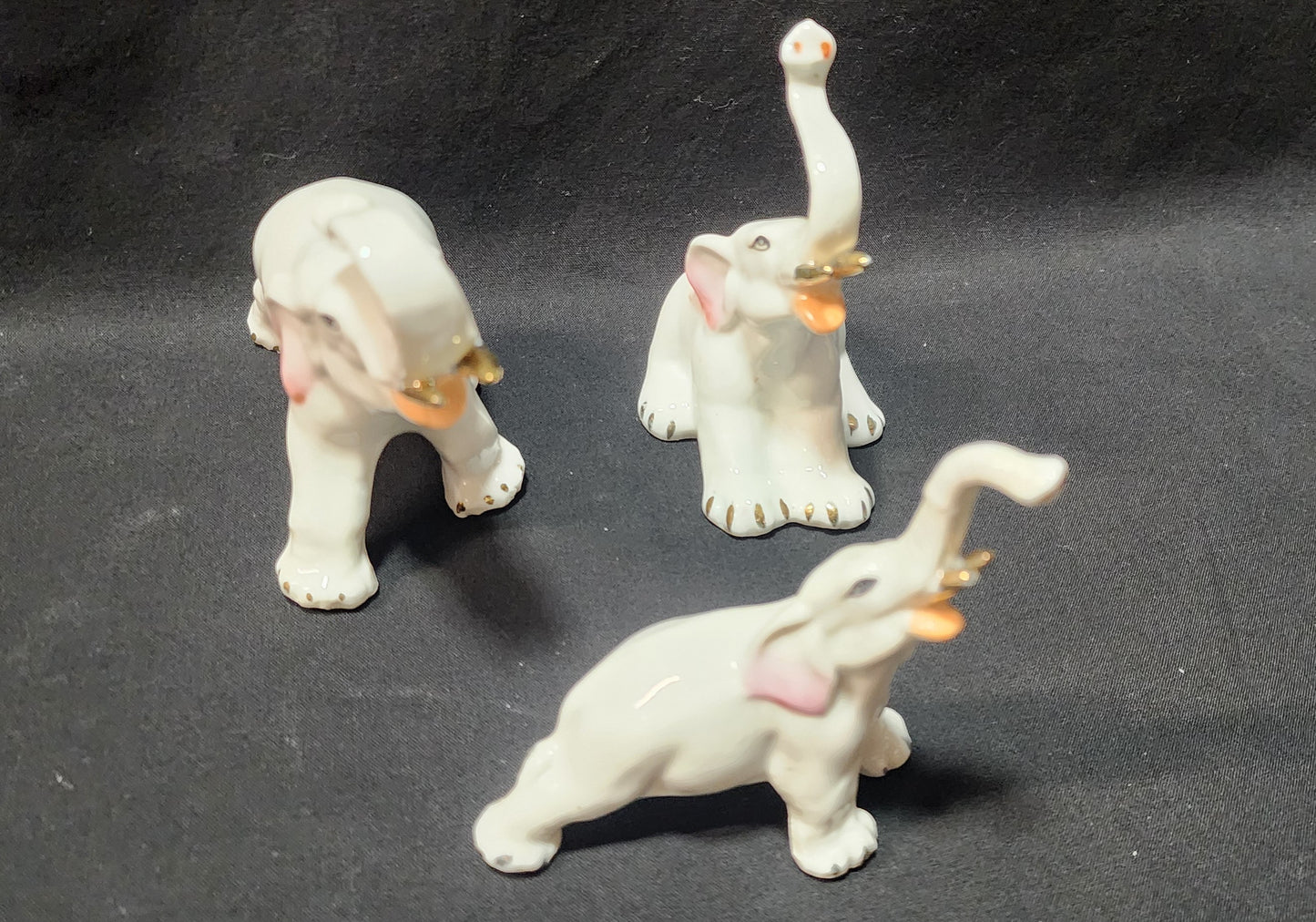 3 White Elephants With Trunks Up and Gold Trimmed